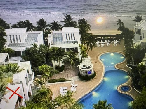 an aerial view of a resort with a pool and the ocean at Natural Villas -Front Samet Beach house with Pool in Rayong