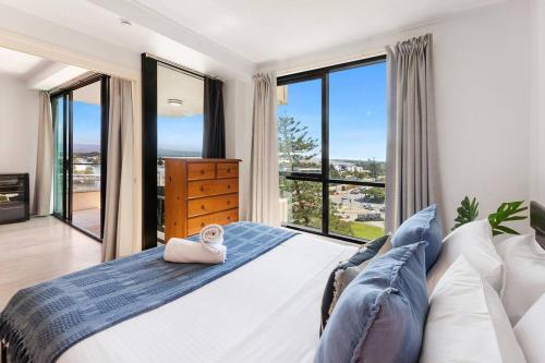 Ένα ή περισσότερα κρεβάτια σε δωμάτιο στο Park Views & Luxe Amenities in Broadbeach