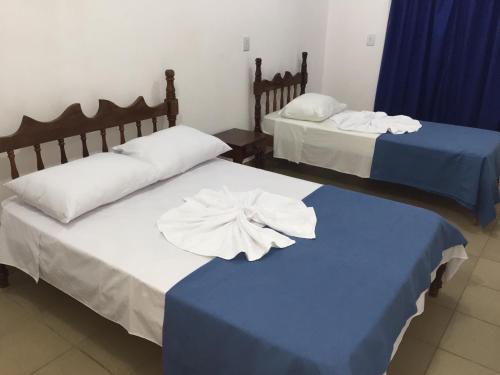 Cama o camas de una habitación en Romax Hotel