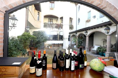 a bunch of bottles of wine sitting on a table at Locanda Stella d'Oro in Soragna