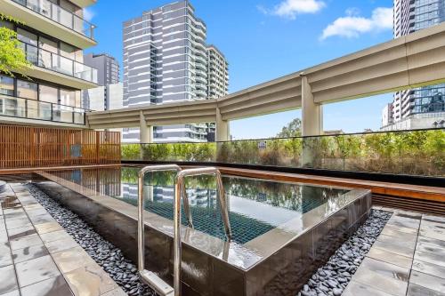 a swimming pool in the middle of a building at Lucia South Yarra Pool Gym free Parking in Melbourne