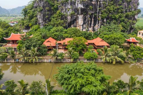 a resort on the side of a mountain at Nui Vang Trang An Hotel Ninh Binh in Ninh Binh