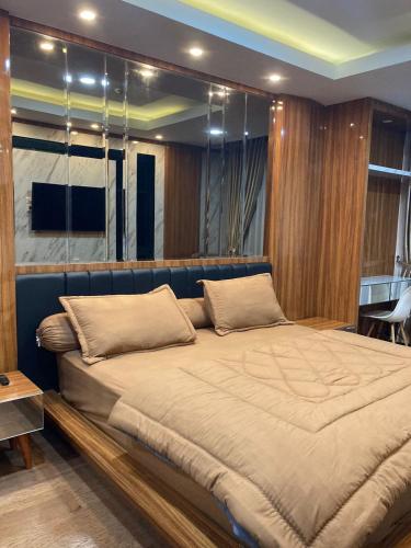 a bedroom with a large bed in a room at Casapedian 010 Vasaka Reiz Condo 1 BR in Medan