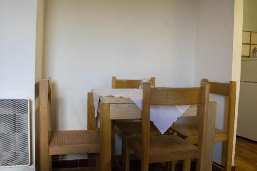 a dining room table and two chairs and a table and chairsktop at Casa San Donato in San Donato in Fronzano