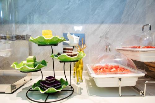 a display in a store with desserts in plastic bags at VX Hotel Shanghai Yixian Road Dabaishu in Shanghai