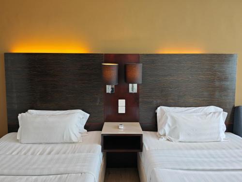 Katil atau katil-katil dalam bilik di Meetsuite at Ming Garden Residence