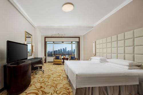 Una televisión o centro de entretenimiento en Shangri-La Fuzhou