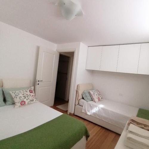 Postel nebo postele na pokoji v ubytování Appartamento in Villa