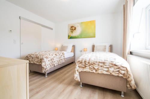 Ένα ή περισσότερα κρεβάτια σε δωμάτιο στο Luxury Zweibrücken 2