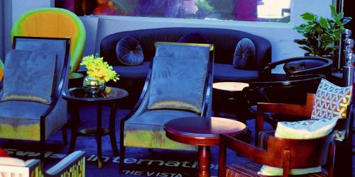a room with chairs and a couch and a table at Swiss International The Vistana Lekki Lagos in Ikota