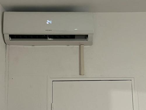 a microwave oven sitting on top of a wall at Appartement hyper centre climatisé in Salon-de-Provence