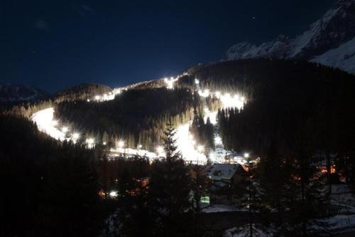 a view of a mountain at night with lights at Mezzodi in Mareson