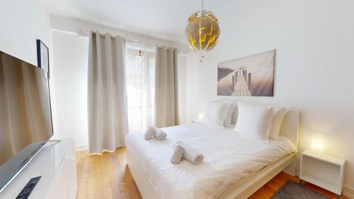 Postel nebo postele na pokoji v ubytování La Symphonie de l'Orangerie