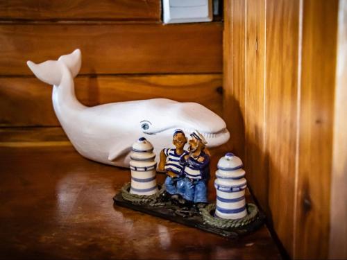 a figurine of two people standing in front of a whale at Chicuanga in Chizavane