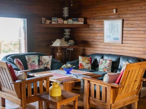 a living room with a table and a couch at Chicuanga in Chizavane