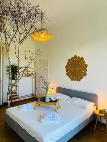 a bedroom with a bed with a table on it at Liberty House in Turin