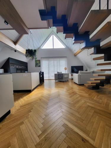 a large living room with a large skylight at Chochołowska Przystań in Chochołów