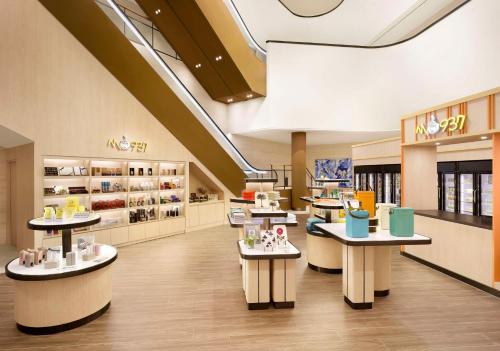 a store with tables and chairs in a store at Cassia Sokcho in Sokcho