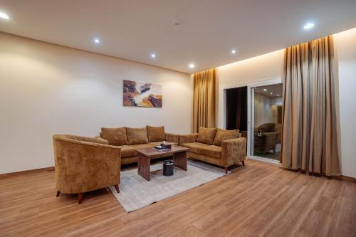 a living room with a couch and a table at مسكن نال in Abha