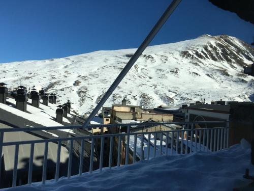 a view of a snow covered mountain from a ski lift at Hotel Casado in Pas de la Casa