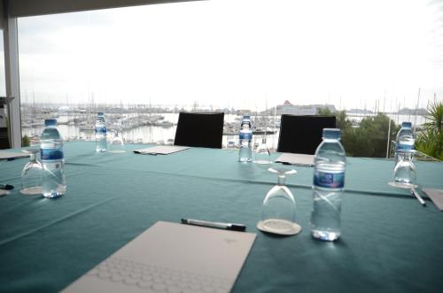 a table with bottles of water and glasses on it at Hotel Costa Azul in Palma de Mallorca