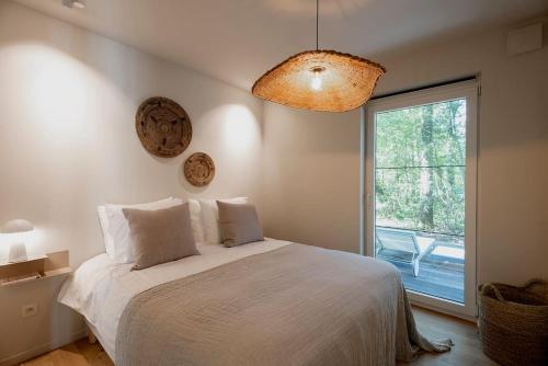 Cama o camas de una habitación en Luxe chalet met sauna in een oase van rust