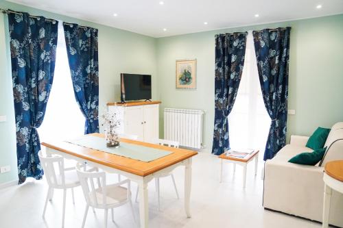 a living room with a table and a couch at Dolce Apartments Albano in Albano Laziale