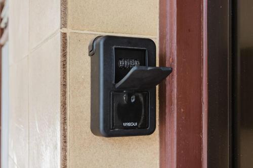 a black electrical outlet on the side of a door at Apartamento Brisa Marina in Arona