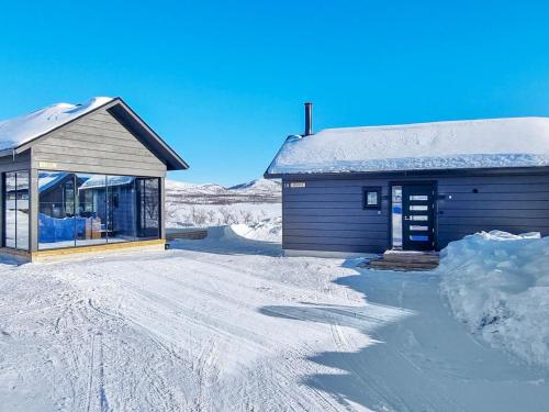 a small building with snow on the ground at Holiday Home Loimu by Interhome in Kilpisjärvi