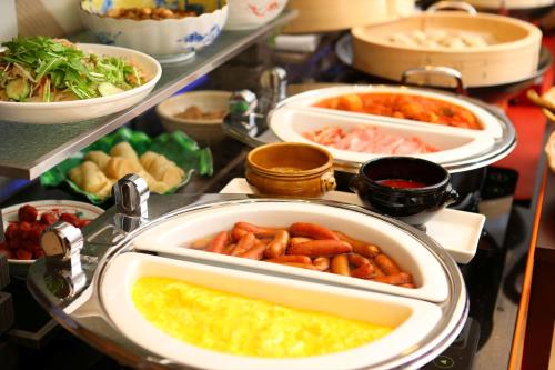 a buffet with different types of food in trays at Almont Inn Shonan Fujisawa in Fujisawa