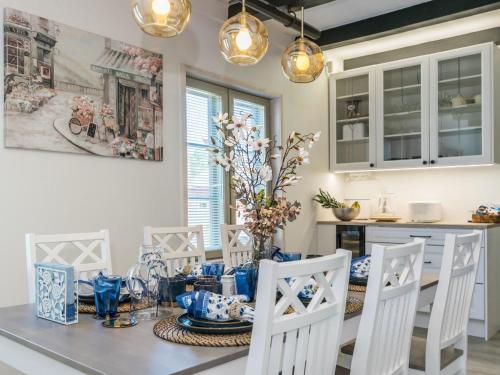 a kitchen and dining room with a table and chairs at Holiday Home Holiday pleikilä by Interhome in Kustavi