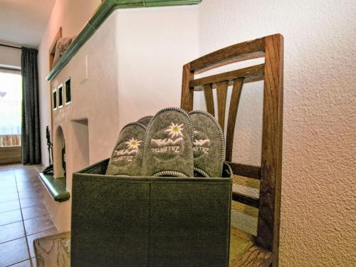 a pair of shoes sitting on top of a chair at Apartment Wandegg by Interhome in Ginzling
