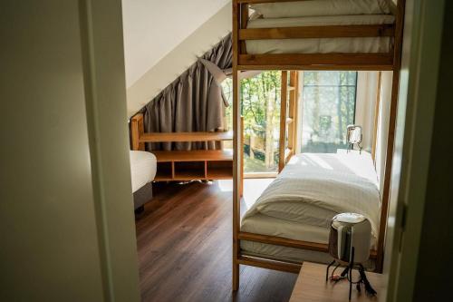 Katil atau katil-katil dalam bilik di Boerderij Villa met Binnenzwembad & Wellness - 12 personen - Resort Valley