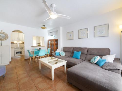a living room with a couch and a table at Apartment Pueblo Marino by Interhome in Garrucha
