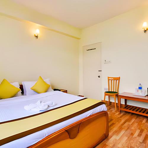 Ένα ή περισσότερα κρεβάτια σε δωμάτιο στο Hotel Renam