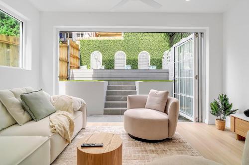 a living room with a couch and a chair at Tranquil Haven in Balmain in Sydney