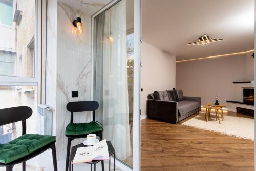 a living room with a couch and a chair at NEW!!!Новая двухкомнатная квартира в самом центре города in Mykolaiv