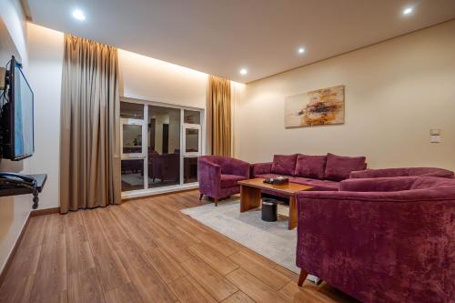 a living room with a couch and a table at مسكن نال in Abha