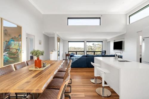 a living room with a couch and a table at Majestic Mountain View in Katoomba in Katoomba