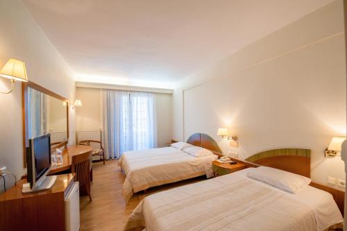 Postel nebo postele na pokoji v ubytování Fthia Hotel