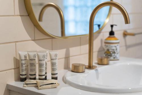 a bathroom sink with toothbrushes and a mirror at Loch Lomond Home Mountain Retreat Katoomba in Katoomba