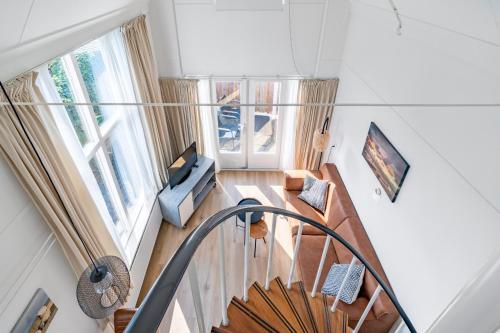 an overhead view of a living room with a staircase at Plevierstraat 3a in De Koog