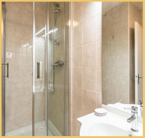 a bathroom with a shower and a sink at Le Salève I Studio I Etrembières in Monnetier-Mornex