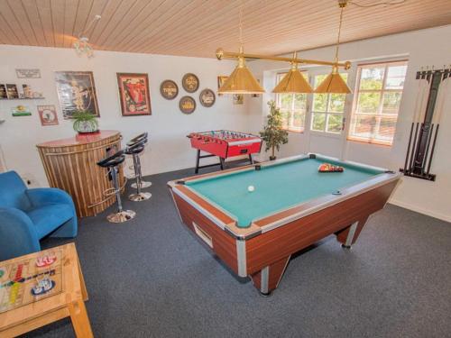 a living room with a pool table in it at Luxury Lodge with Limfjord View - By Traum Ferienwohnungen in Spottrup