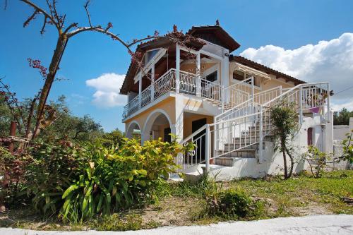 a large white house with a balcony at Zante View Family Studio 3 in Tsilivi