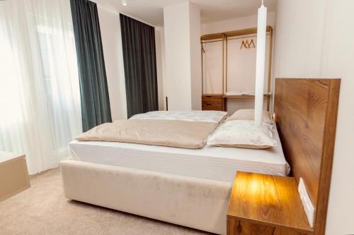 Postel nebo postele na pokoji v ubytování Hotel Marina Home