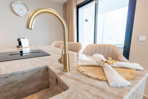 a kitchen counter with a sink with towels on it at Málaga Benalmádena Vacation Rentals five minutes from the Port of Benalmádena Beach Pool and Sun in Benalmadena Costa
