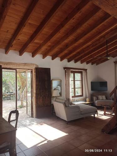 a living room with a couch and a table at Finca SAlzinar in Inca