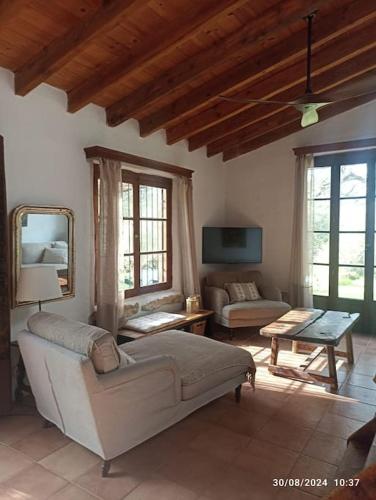 a living room with a couch and a table at Finca SAlzinar in Inca