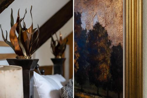 two pictures of a painting and a vase with plants at The Old Coach House - Converted barn with private garden parking and fireplace in Totnes